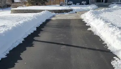 Cleared driveway after expert snow removal by Chop Chop Landscaping in Salt Lake City, UT